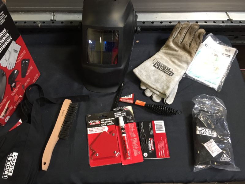 Photo 3 of Auto-Darkening Welding Helmet Starter Kit with No. 11 Lens, Gloves, Wire Brush, Magnet, Chipping Hammer and Marker(SOME ITEMS ARE USED OTHERS ARE NEW, GLOVES ARE DIRTY)