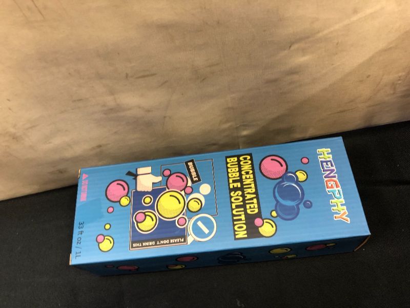 Photo 1 of HENGPHY Bubble Solution Concentrate, 33 oz (Up to 2.5 Gallon) Giant Bubbles Mix Refills Non Toxic with Leak-Proof Design Bubble Liquid
