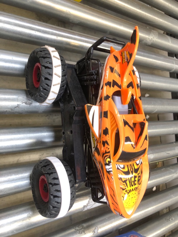 Photo 4 of Hot Wheels Monster Trucks, Remote Control Car, Monster Truck Toy with All-Terrain Wheels, 1:15 Scale Unstoppable Tiger Shark RC