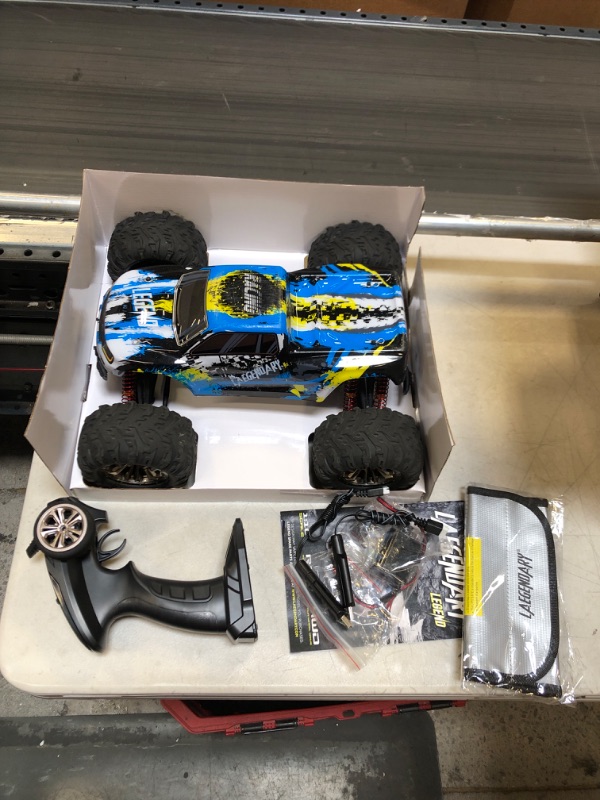 Photo 2 of LAEGENDARY Fast RC Cars for Adults and Kids - 4x4, Off-Road Remote Control Car - Battery-Powered, Hobby Grade, Waterproof Monster RC Truck - Toys and Gifts for Boys, Girls and Teens Blue - Yellow Blue Yellow Up to 31 mph