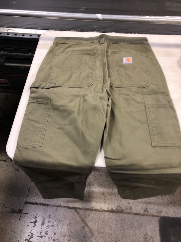 Photo 2 of CARHARTT WIP GREEN STONE PANTS 
31X 34 INCH 