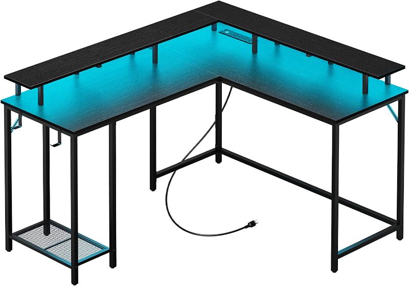 Photo 1 of SUPERJARE L Shaped Computer Desk with Power Outlets & LED Strips, Reversible Corner Desk, Monitor Stand & Storage Shelf, Black, 7933BC