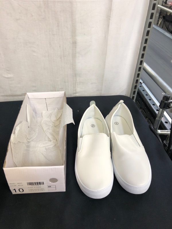 Photo 1 of WHITE SLIP ON SHOES, SIZE 10 MENS