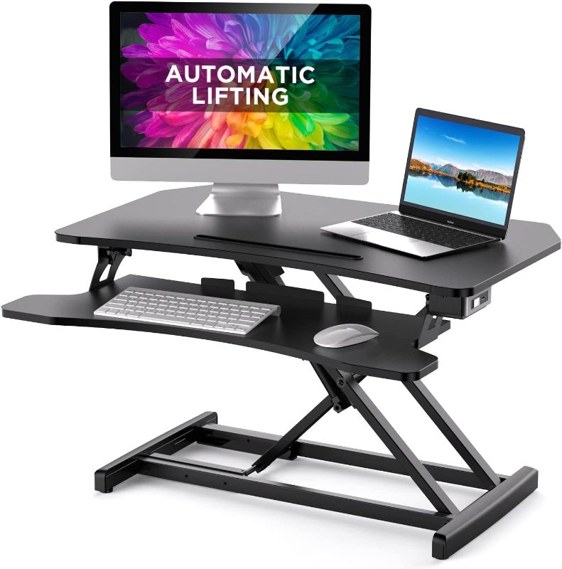 Photo 1 of Electric Standing Desk Converter, 32'' Motorized Stand Up Desk Computer Desk Riser for Home Office, Standing Desk Adjustable Height for Dual Monitor, Stand Up Desk Converter with Keyboard Tray, Black
