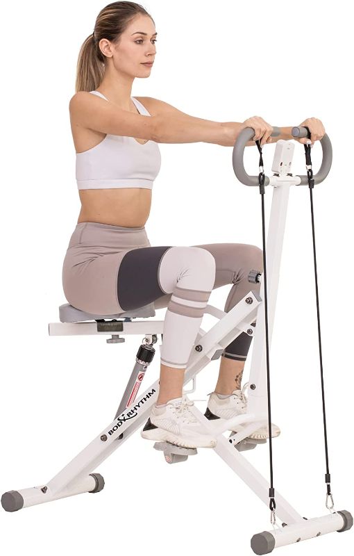 Photo 1 of BODY RHYTHM Squat Assist Row-N-Ride Trainer. Box packaging Badly Damaged, Moderate Use, Item has Minor scratchs and Scuffs on Metal. Missing Parts.  Hardware Loose in Box, Missing Hardware
