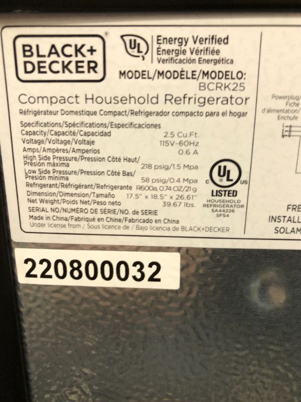 Photo 7 of BLACK+DECKER BCRK25B Compact Refrigerator Energy Star Single Door Mini Fridge with Freezer, 2.5 Cubic Feet, Black. no Bo Packaging, Item is new, item is damaged from shipping and handling, scratchs an scuffs on item, Dent on top corner. Item turns on did 