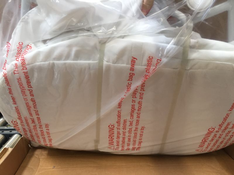 Photo 1 of Dream On Me Lacy Portable 2-in-1 Bassinet, White. Box Packaging is Damaged, Item is New, Item is Sealed
