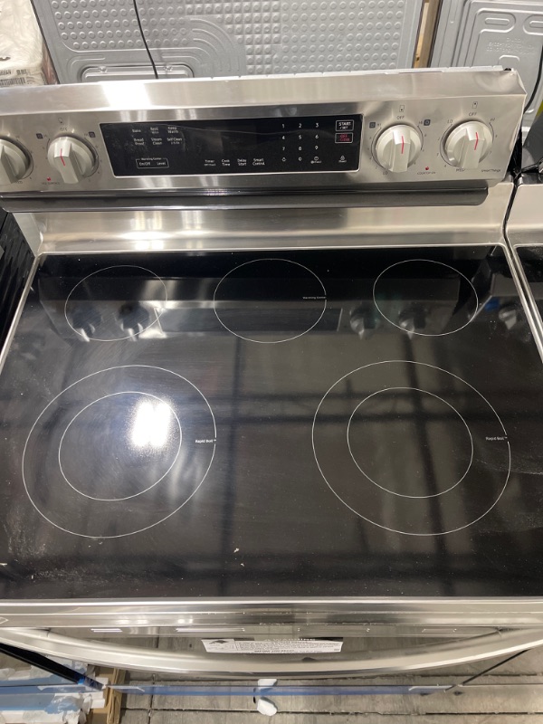 Photo 3 of 6.3 cu. ft. Smart Freestanding Electric Range with Rapid Boil™ & Self Clean in Stainless Steel *minor cosmetic dmg* 
