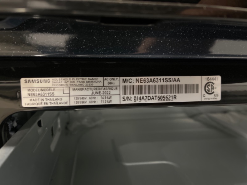 Photo 4 of 6.3 cu. ft. Smart Freestanding Electric Range with Rapid Boil™ & Self Clean in Stainless Steel *COSMETIC DAMAGE, NO ACCESSORIES INCLUDED.
