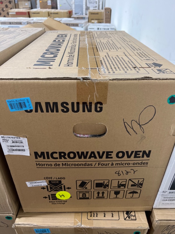 Photo 2 of Samsung 1.7 Cu. Ft. Fingerprint Resistant Stainless Steel Over-The-Range Microwave - factory sealed