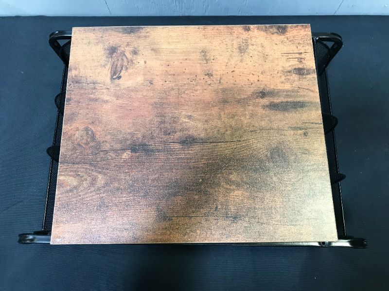 Photo 3 of BLACK METAL STAND WITH SIDE HOLDERS AND WOODEN TOP. ITEM IS DAMAGED, DENT TO METAL AND MISSING SCREWS TO WOODEN TOP