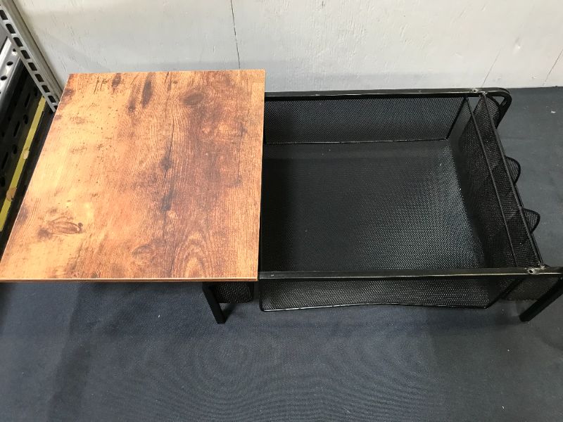 Photo 2 of BLACK METAL STAND WITH SIDE HOLDERS AND WOODEN TOP. ITEM IS DAMAGED, DENT TO METAL AND MISSING SCREWS TO WOODEN TOP