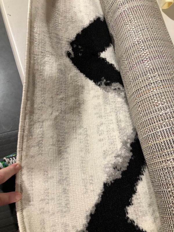 Photo 1 of nuloom grey and black zigzag pattern 6'7 x 9 