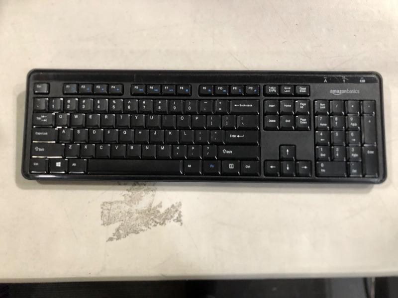 Photo 1 of Amazon Basics Wireless Computer Keyboard and Mouse Combo - Quiet and Compact - US Layout (QWERTY)
