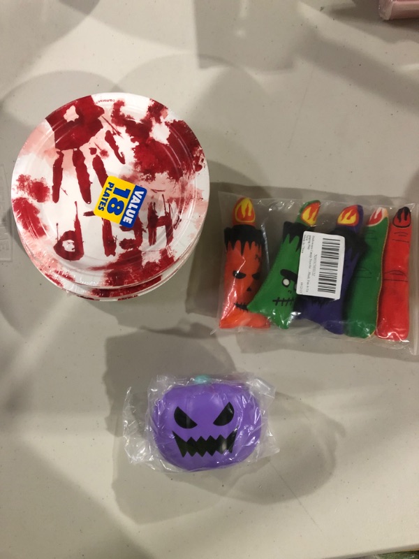 Photo 1 of  Misc. Halloween party supplies. Plates toys and party gifts.