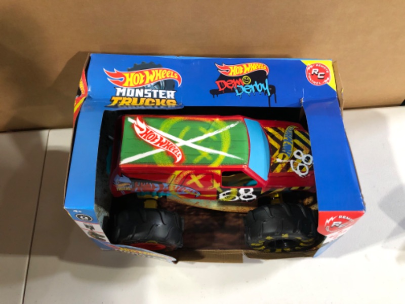 Photo 2 of ?Hot Wheels RC Monster Trucks 1:15 Scale HW Demo Derby, 1 Remote-Control Toy Truck with Terrain Action Tires