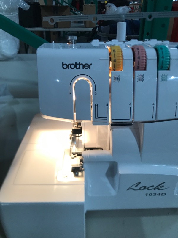 Photo 3 of Brother Serger, 1034D, Heavy-Duty Metal Frame Overlock Machine, 1,300 Stitches Per Minute, Removeable Trim Trap, 3 Included Accessory Feet,White