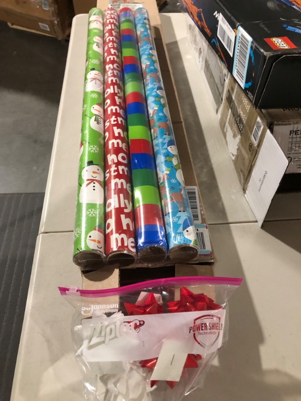 Photo 2 of American Greetings Reversible Christmas Extra-Wide Wrapping Paper Bundle, Santa, Snowmen and Candy Canes (3 Rolls, 120 sq. ft.)