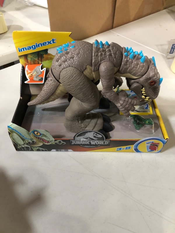 Photo 2 of Fisher-Price Imaginext Jurassic World Indominus Rex Dinosaur Toy with Thrashing Action and Raptor Dinosaur for Preschool Pretend Play