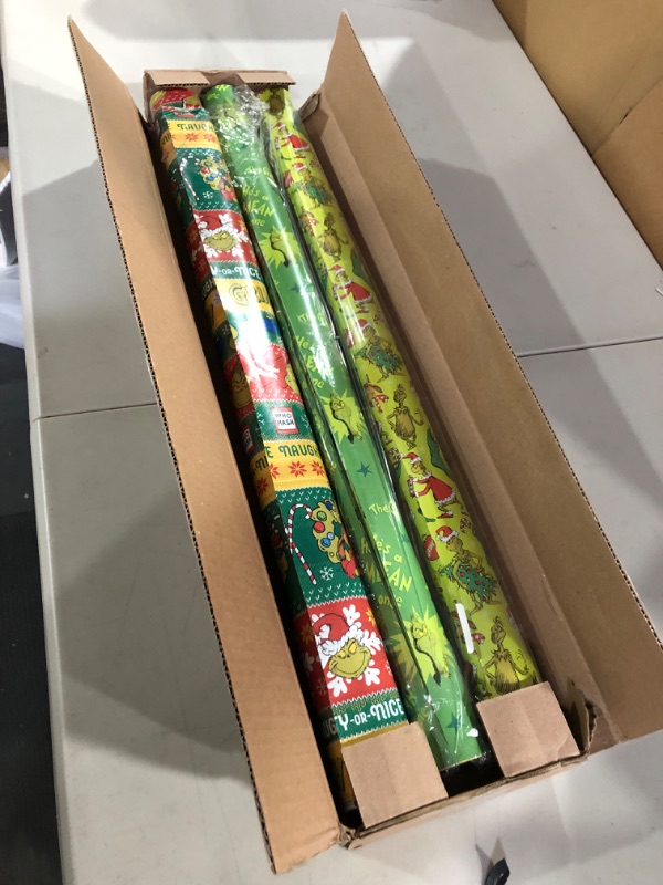 Photo 2 of American Greetings Christmas Wrapping Paper with Cut Lines Bundle, The Grinch (3 Rolls, 105 sq. ft.)