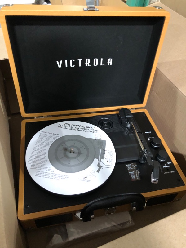 Photo 2 of Victrola Vintage 3-Speed Bluetooth Portable Suitcase Record Player with Built-in Speakers, Upgraded Turntable Audio Sound, Cognac Cognac Record Player
**UNKNOWN**