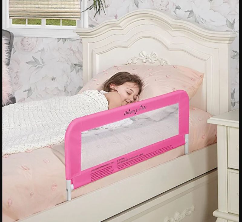 Photo 1 of Dream On Me Lightweight Mesh Security Adjustable Bed Rail for Toddler with Breathable Mesh Fabric in Blush Pink