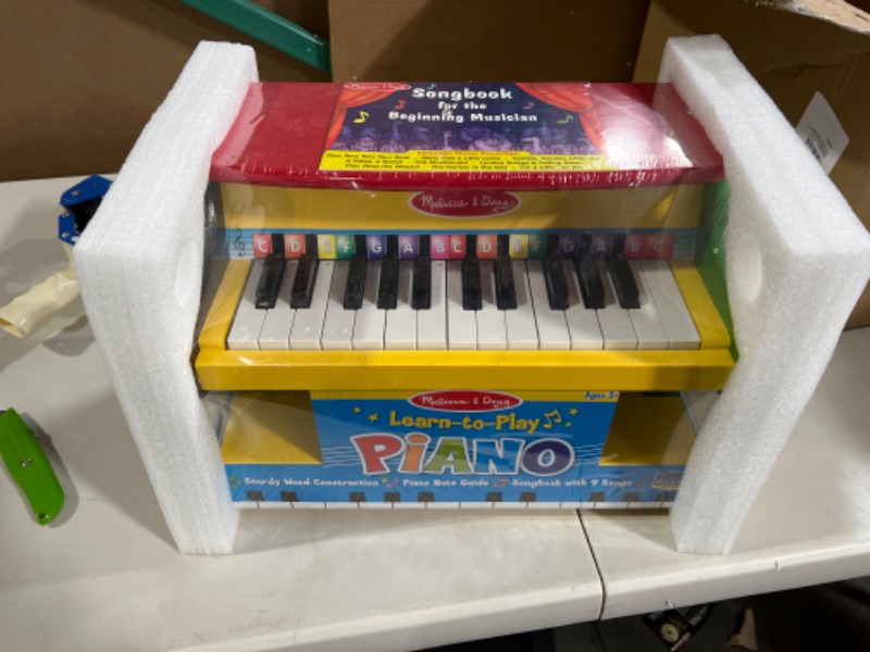 Photo 2 of Melissa & Doug Learn-To-Play Piano With 25 Keys and Color-Coded Songbook - Toy Piano For Baby, Kids Piano Toy, Toddler Piano Toys For Ages 3+