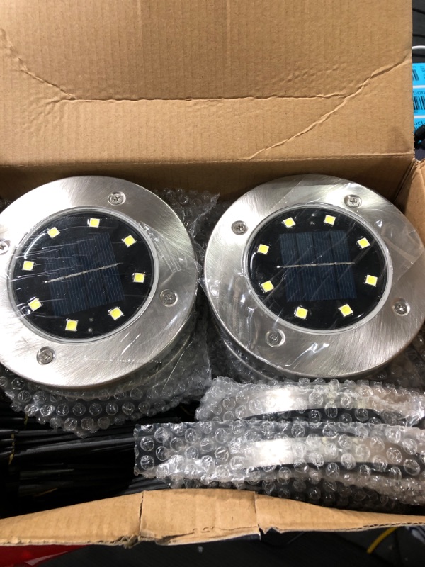 Photo 1 of Biling Solar Disk Lights Outdoor, 12 Pack Solar Ground Lights Outdoor Waterproof for Garden Yard Patio Pathway Lawn Driveway - Warm White
