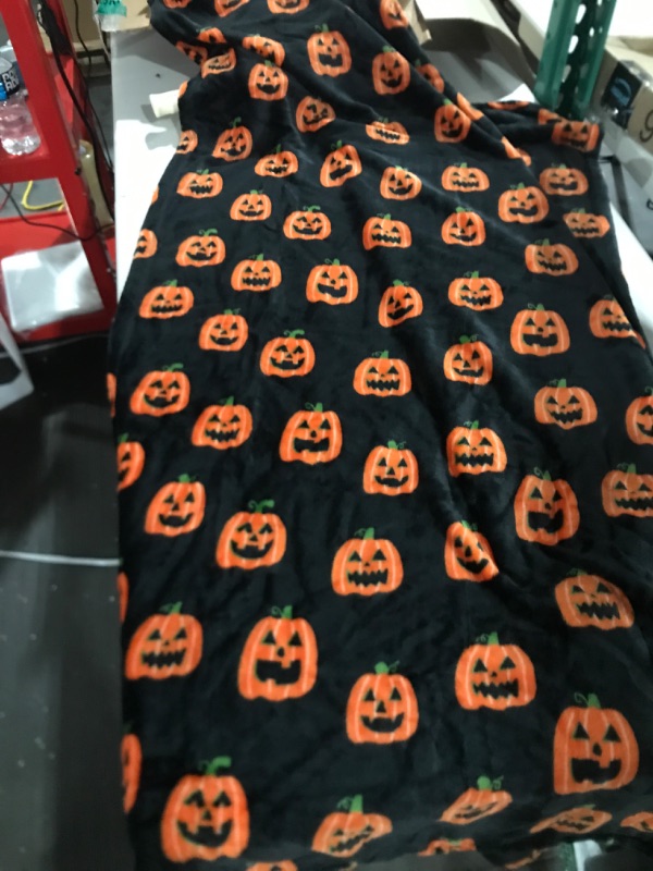 Photo 1 of 60" x 48" jack o'lantern throw blanket 