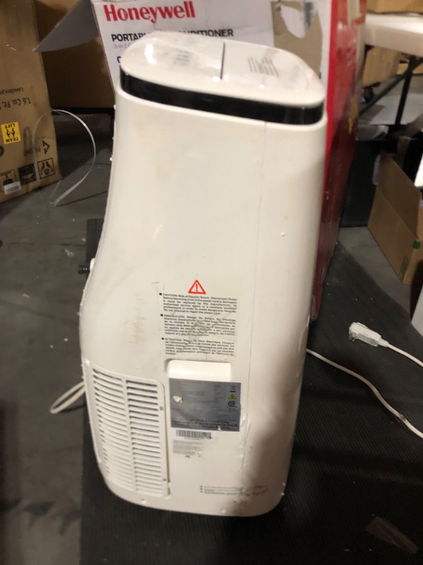 Photo 2 of **minor damage to power cable and back / side of unit** Honeywell 10,000 BTU Portable Air Conditioner with Dehumidifier & Fan Cools Rooms Up To 450 Sq. Ft. with Remote Control, HJ0CESWK7, White/Black Up to 450 Sq. Ft. Cooling Only