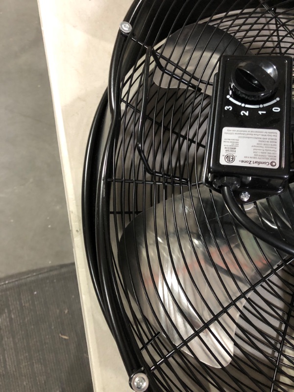 Photo 2 of Comfort Zone 20 3-Speed High-Velocity Industrial Slim-Profile Drum Fan with Aluminum Blades and Adjustable Tilt Black.
** Damaged ** powers up motor but fan doesn't move.  Base is also damaged, wobble.