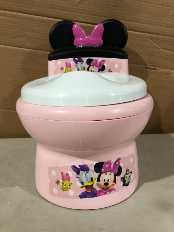 Photo 3 of The First Years Disney Minnie Mouse Potty and Trainer Seat.
* Damaged, rear of product out of shape. * (See pic)