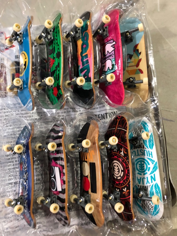 Photo 2 of TECH DECK, DLX Pro 10-Pack of Collectible Fingerboards, for Skate Lovers, Kids Toy for Ages 6 and up