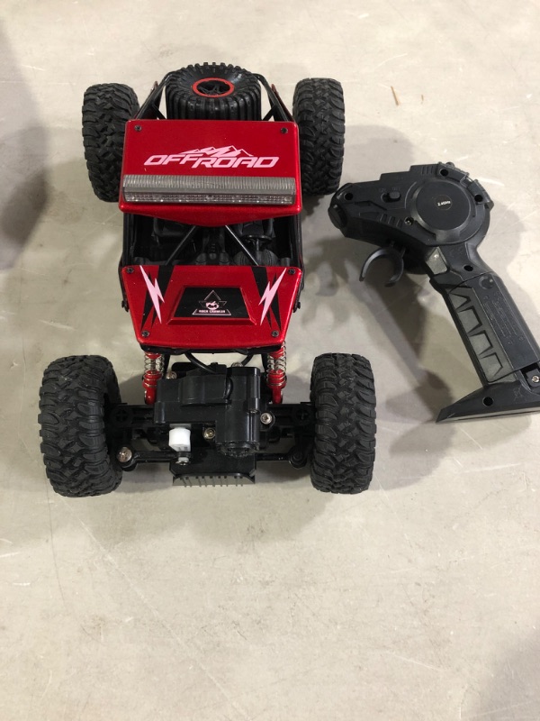 Photo 2 of Rc Car, NQD Remote Control Monster Truck, 2.4Ghz 4wd Off Road Rock Crawler Vehicle, 1:16 All Terrain Rechargeable Electric Toy for Boys & Girls Red