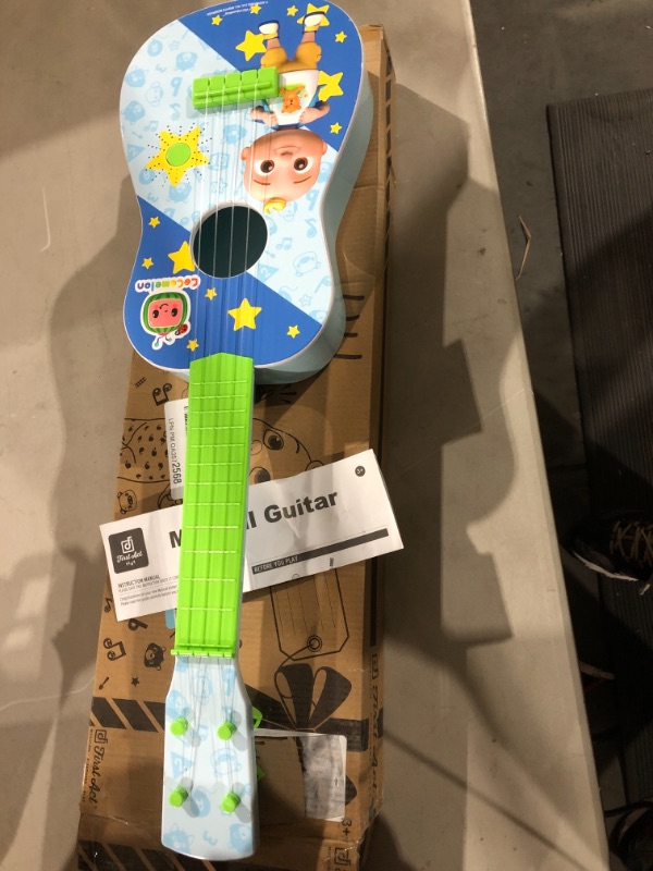 Photo 2 of CoComelon Musical Guitar by First Act, 23.5” Kids Guitar - Plays Clips of The ‘Finger Family’ Song - Musical Instruments for Kids, Toddlers, and Preschoolers