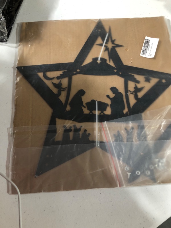 Photo 1 of black metal star with nativity scene 