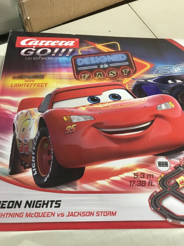 Photo 2 of Carrera GO!!! 62477 Disney Pixar Cars Neon Nights Electric Slot Car Racing Kids Toy Race Track Set Includes 2 Controllers and 2 Cars