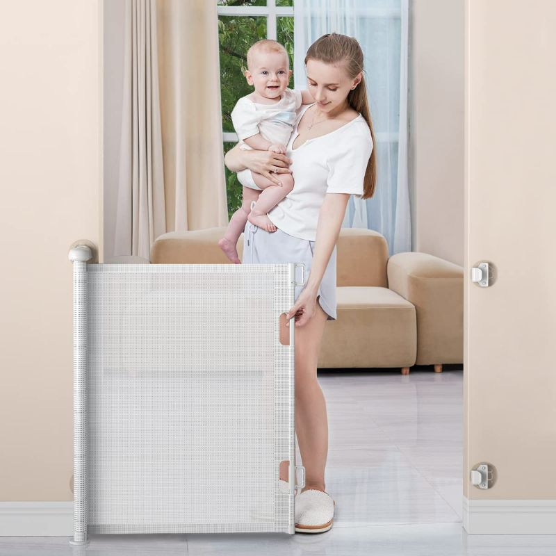 Photo 1 of BabyBond Retractable Baby Gates, Punch-Free Install Baby Gate Extra Wide 71” X 33” Tall for Kids or Pets Indoor and Outdoor Dog Gates for Doorways, Stairs, Hallways, Grey 33*71 Inch Grey