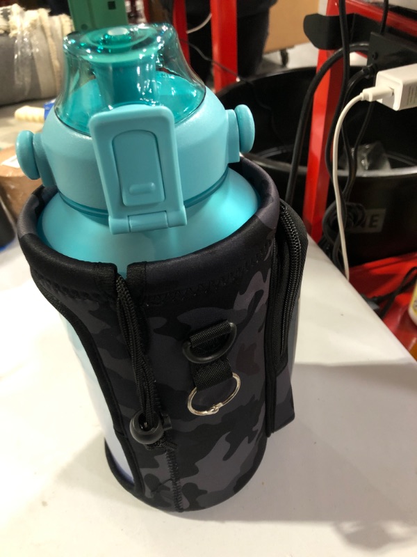 Photo 1 of 64 ounce water bottle with straw and lid 