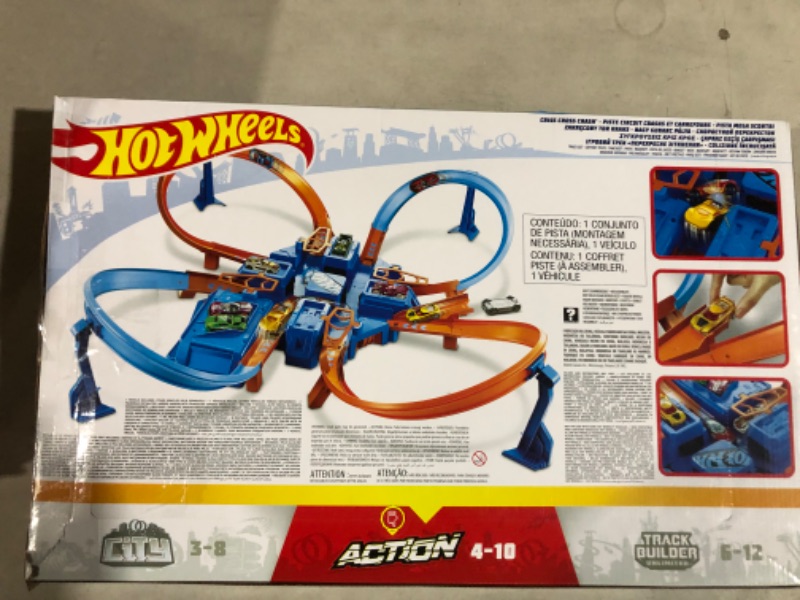 Photo 3 of Hot Wheels Track Set with 1:64 Scale Toy Car, 4 Intersections for Crashing, Powered by a Motorized Booster, Criss-Cross Crash Track????