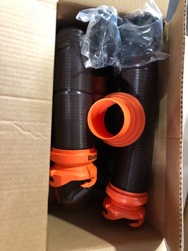 Photo 2 of Camco 20' (39742) RhinoFLEX 20-Foot RV Sewer Hose Kit, Swivel Transparent Elbow with 4-in-1 Dump Station Fitting-Storage Caps Included , Black , Brown 20ft Sewer Hose Kit Frustration-Free Packaging