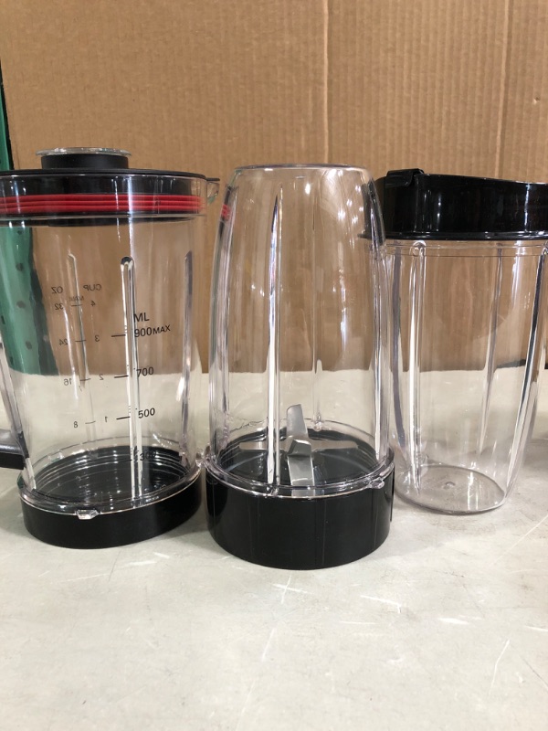 Photo 5 of Chefman Countertop + Travel Dynamic Blending System, Dishwasher-Safe 
* Used, base and 1 tumbler * Other 3 cups appear unused. * Unit powers up *