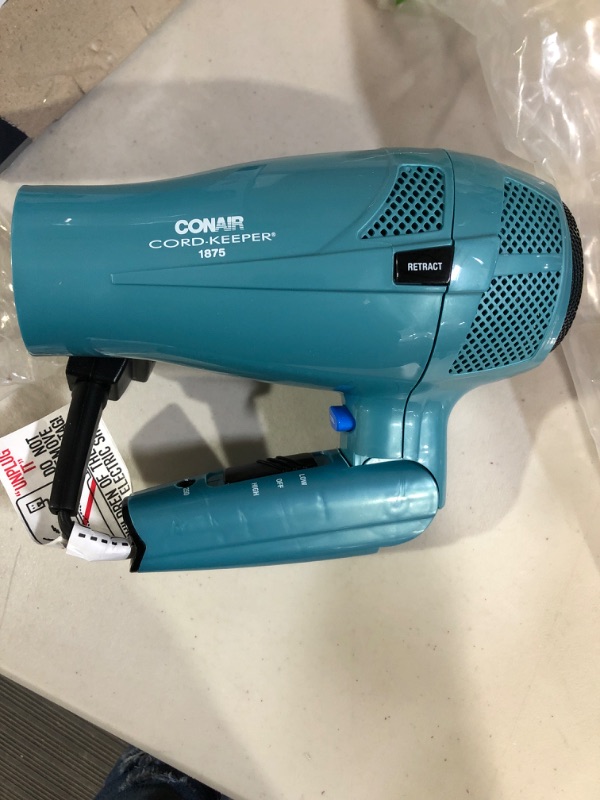 Photo 2 of Conair Hair Dryer with Folding Handle and Retractable Cord