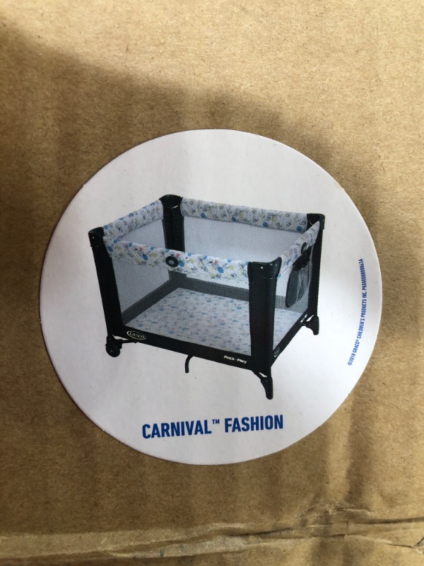 Photo 3 of Graco Pack and Play Portable Playard, Push Button Compact Fold, Carnival Portable Playard Carnival