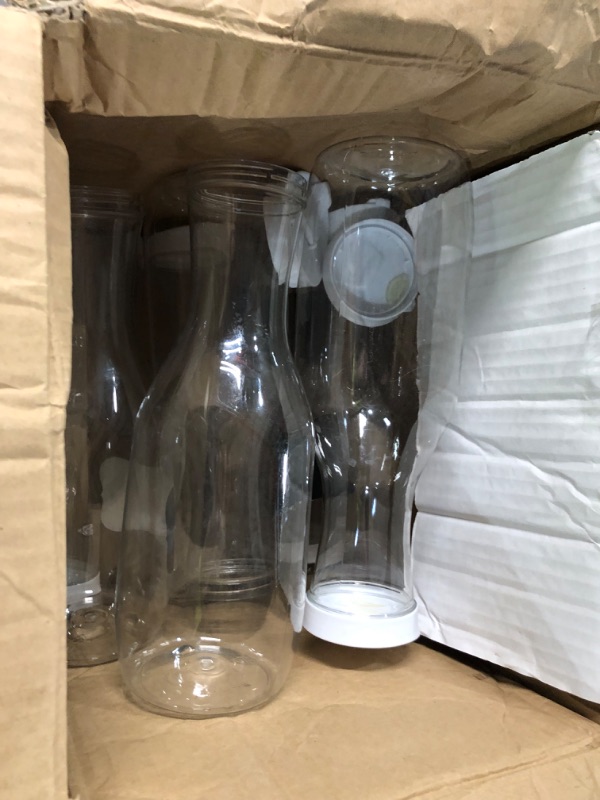 Photo 3 of ***DAMAGED*** Tomnk 8 Pack 50 Oz Water Carafe with Flip Top Lid, Plastic Heavy Duty Water Containers