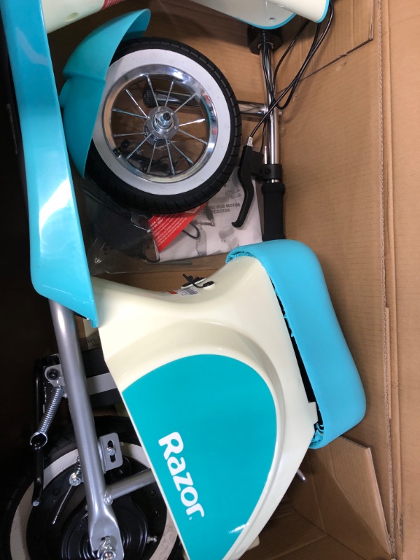 Photo 2 of Razor Pocket Mod Petite - 12V Miniature Euro-Style Electric Scooter for Ages 7+, 100-watt Motor, Up to 40 min Ride Time, For Riders up to 110 lbs