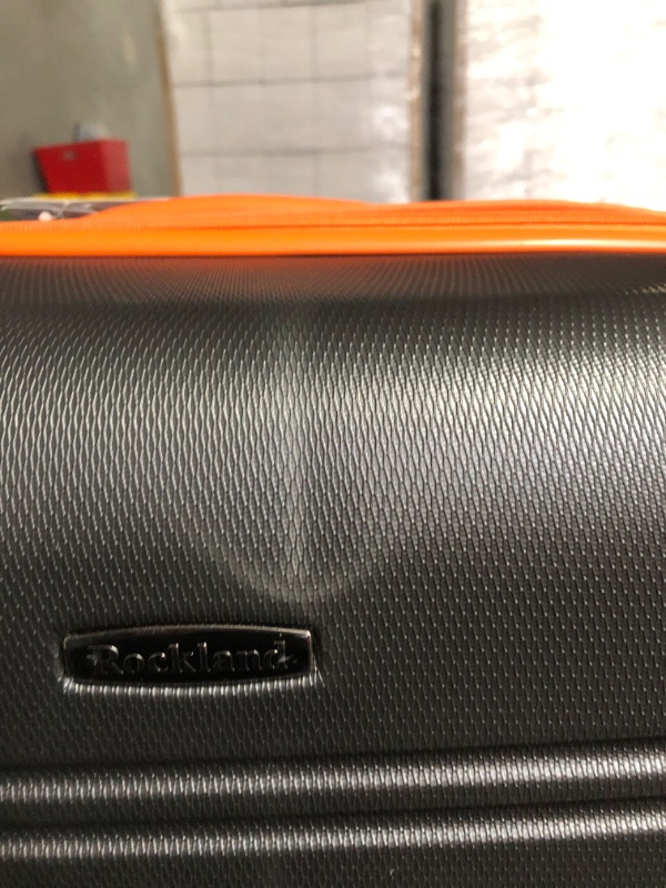 Photo 13 of **USED**CORNERS ARE DENTED IN ON 28 IN**SEE PICTURES **Rockland Melbourne Hard side Expandable Spinner Wheel Luggage, (Charcoal N Orange), 2-Piece Set (20/28)