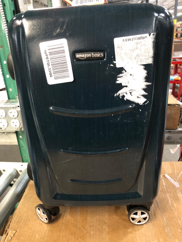 Photo 1 of (Minor Damage) Amazon Basics 21 inch carry on luggage with wheels Dark Blue 