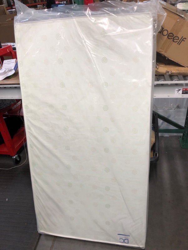 Photo 1 of Delta Children Twinkle Galaxy Dual Sided Premium Recycled Fiber Core Crib and Toddler Mattress 