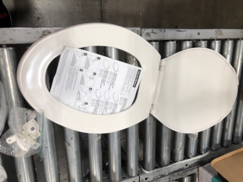 Photo 2 of **MISSING HARDWARE** American Standard 5503A00B.020 Slow Elongated Closed Front Toilet Seat, White
